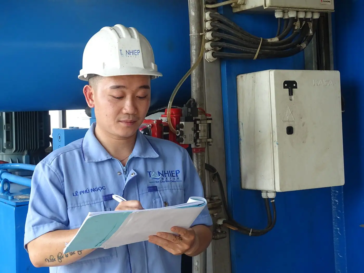 A technician recording an inspection on site