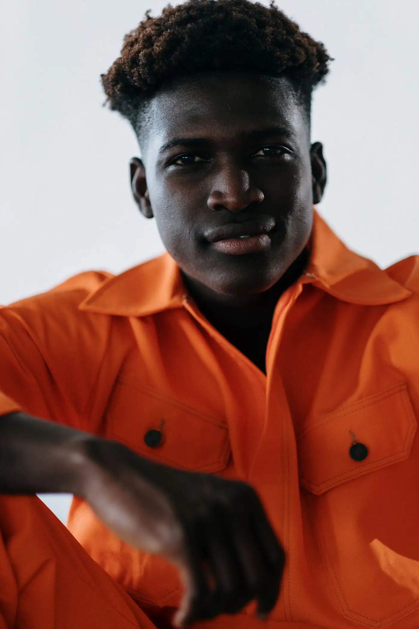 A newly qualified artisan in workshop overalls